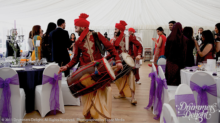 Read more about the article Dhol Players in Red Dhoti Costume